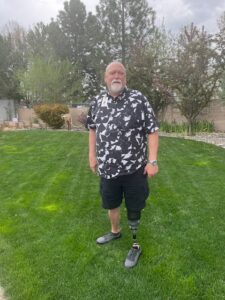 Steve Maxwell standing in Empowerment Center backyard on lawn